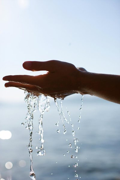 hands-with-water-flowing-woods-wheatcroft