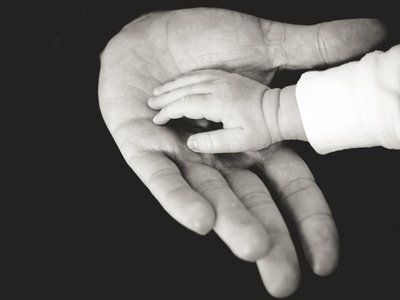 Adult and baby hands